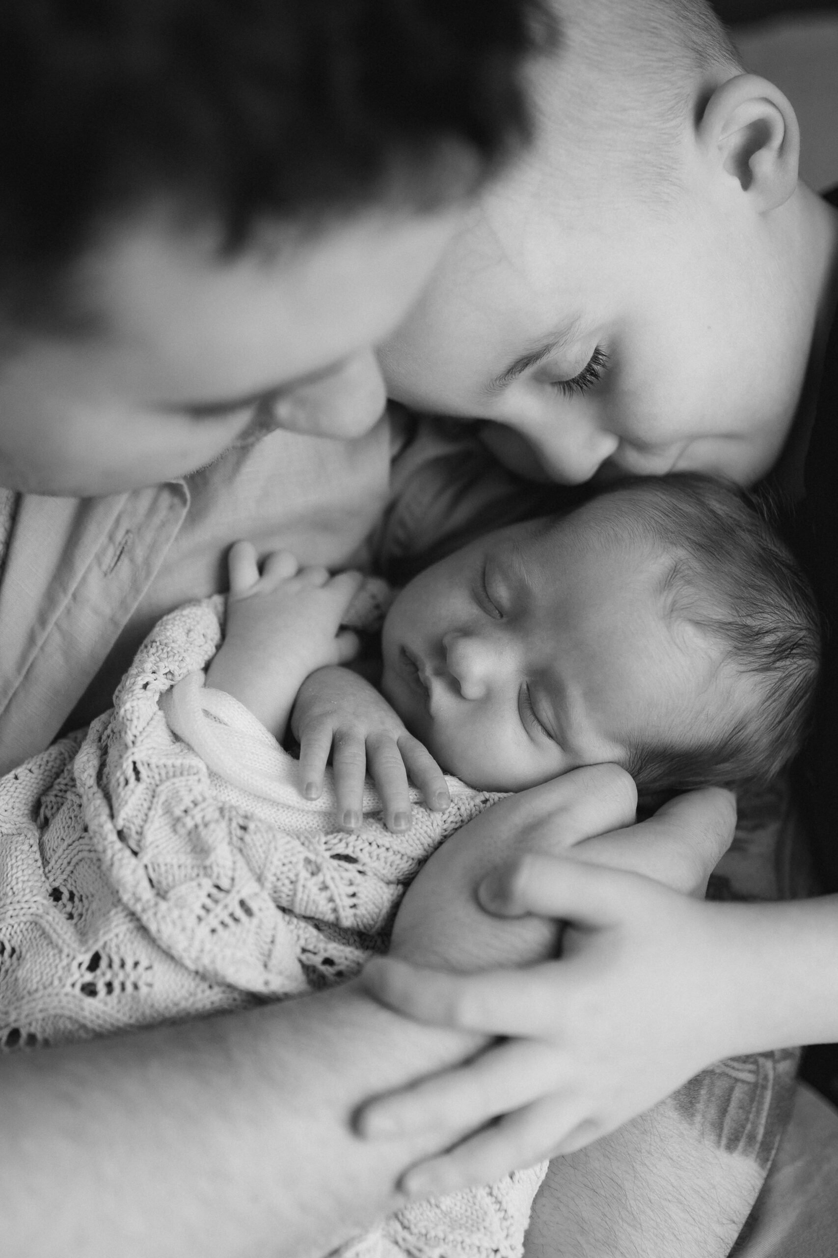 melbourne newborn photography with siblings natural light black and white connection and love